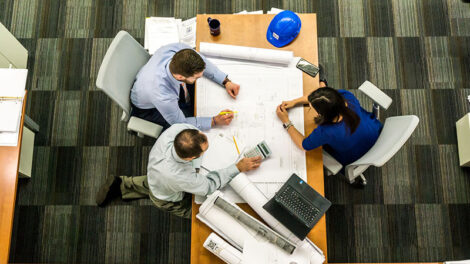 overhead view of engineering group and plans offering project management and consultants services